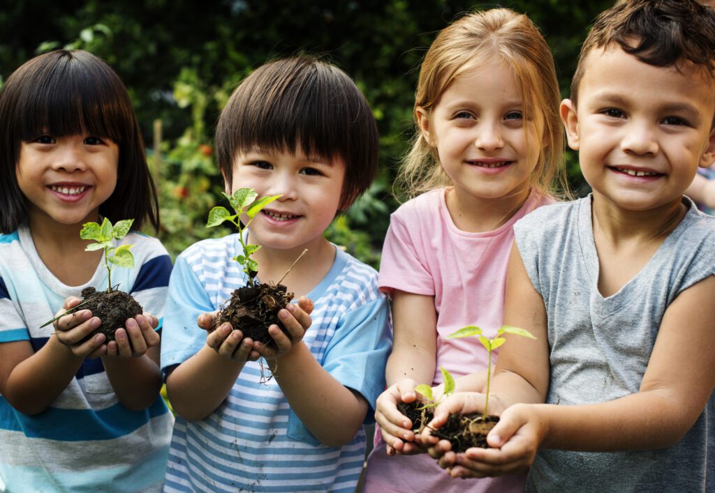 Image of a group of kids planting at a Dunlap Private Kindergarten